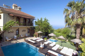 Отель 6 bedrooms villa with sea view private pool and jacuzzi at Fethiye 2 km away from the beach  Узунюрт